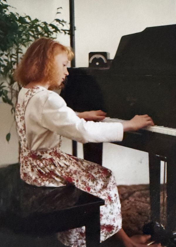 Chanté at the piano as a teenager